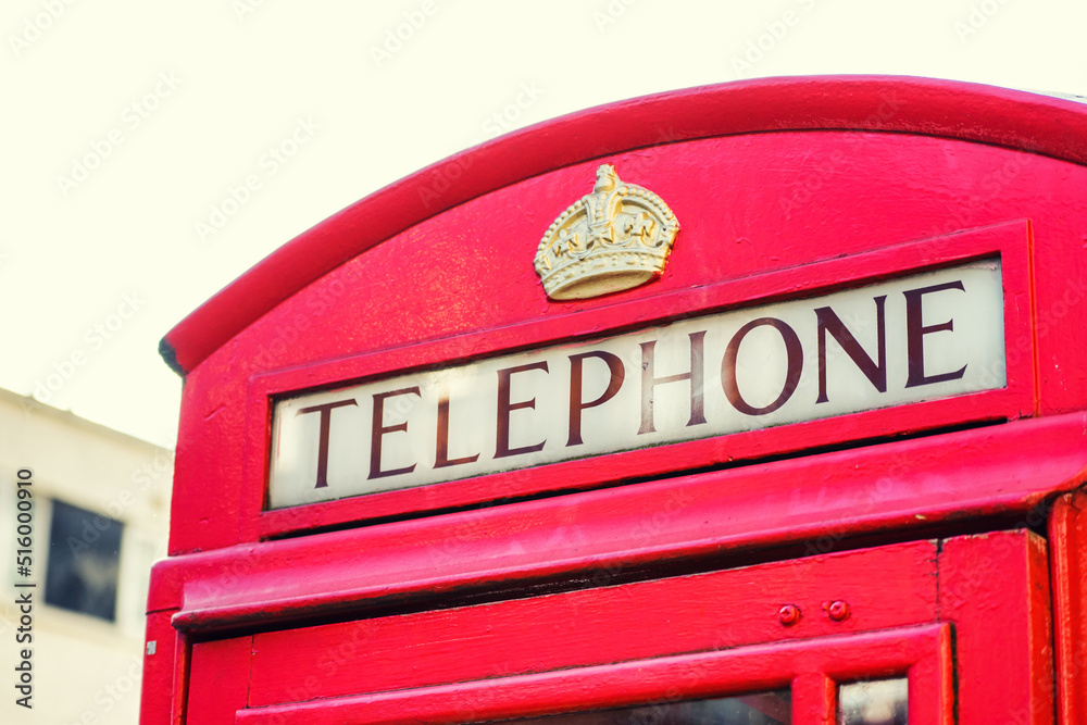 LONDON, UK - 18 FEBRUARY, 2017: An old traditional English phone box. LONDON, UK - 18 FEBRUARY, 2017: An old traditional English phone box.