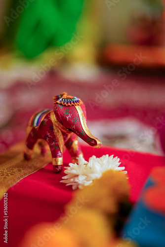 Small lord Ganesha or elephant sculpture with flower