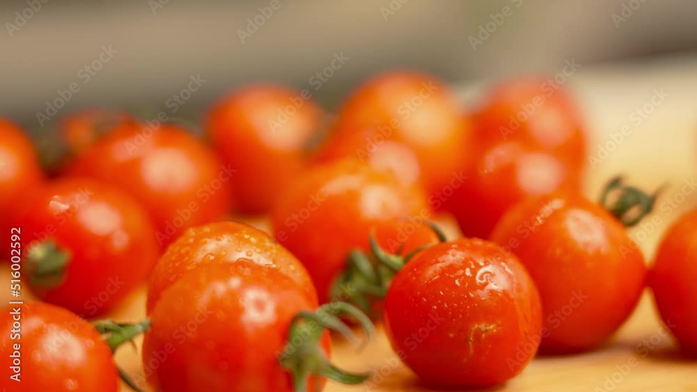 Bunch of red cherry tomatoes with water drops Bunch of red cherry tomatoes with water drops