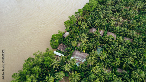 homestay hotel in the tropical jungle coastline of the brown mekong river in Ben Tre Vietnam