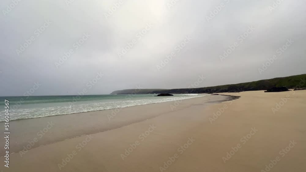 beautiful, lonely wilderness of the Port Ness Beach, Isle of Lewis, Outer Hebrides, in a windy, rainy day with steady drizzle. White sands, paradise beach, Atlantic weather. Scotland. beautiful, lonely wilderness of the Port Ness Beach, Isle of Lewis, Outer Hebrides, in a windy, rainy day with steady drizzle. White sands, paradise beach, Atlantic weather. Scotland.
