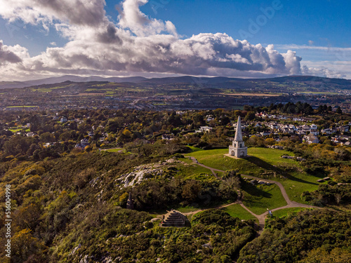 Photography Aerial view of the pyramid and obelisk over the Killiney Hill with the clouds in