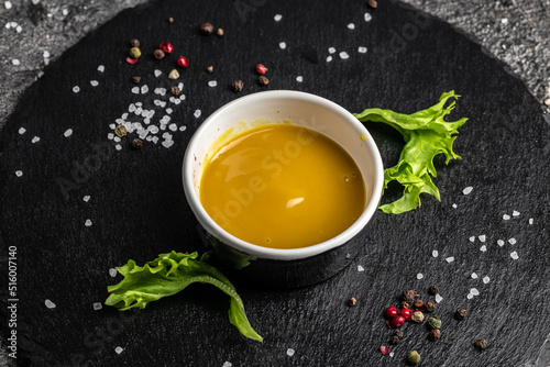 Fresh homemade organic mustard and honey sauce on a dark background, Food recipe background. Close up