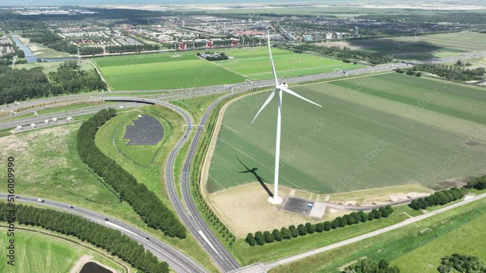 Wind turbine system sustainable energy generation on a wind farm in the countryside. Clean green renewable energy generation infrastructure and solar panels. Wind turbine system sustainable energy generation on a wind farm in the countryside. Clean green renewable energy generation infrastructure and solar panels.