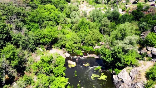 Drone shot Butsky Canyon Ukraine. Aerial view of a rocky canyon on the Gorny Tikich River near the village of Buki. River Gorny Tikich in Proterozoic granites. Ancient deep and narrow canyon  photo