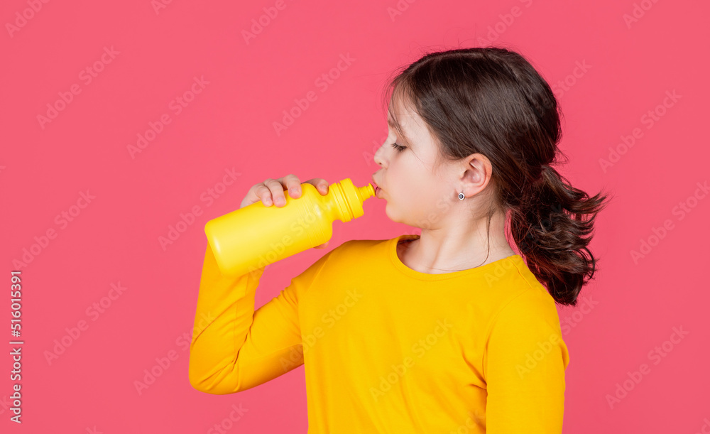 thirsty kid drinking water on pink background thirsty kid drinking water on pink background