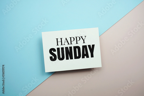 Happy Sunday text message on blue and pink background