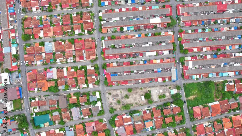 An aerial view over a large residence in Bang yai, Nonthaburi, Thailand. Time lapse of moving cars and motorcycles. Cloud shadows moving over the village. hyperlapse. drones. 4K
An aerial view over a large residence in Bang yai, Nonthaburi, Thailand. Time lapse of moving cars and motorcycles. Cloud shadows moving over the village. hyperlapse. drones. 4K