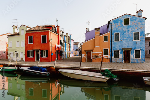 Street with colorful houses on the island of Burano in the morning. Italy.
