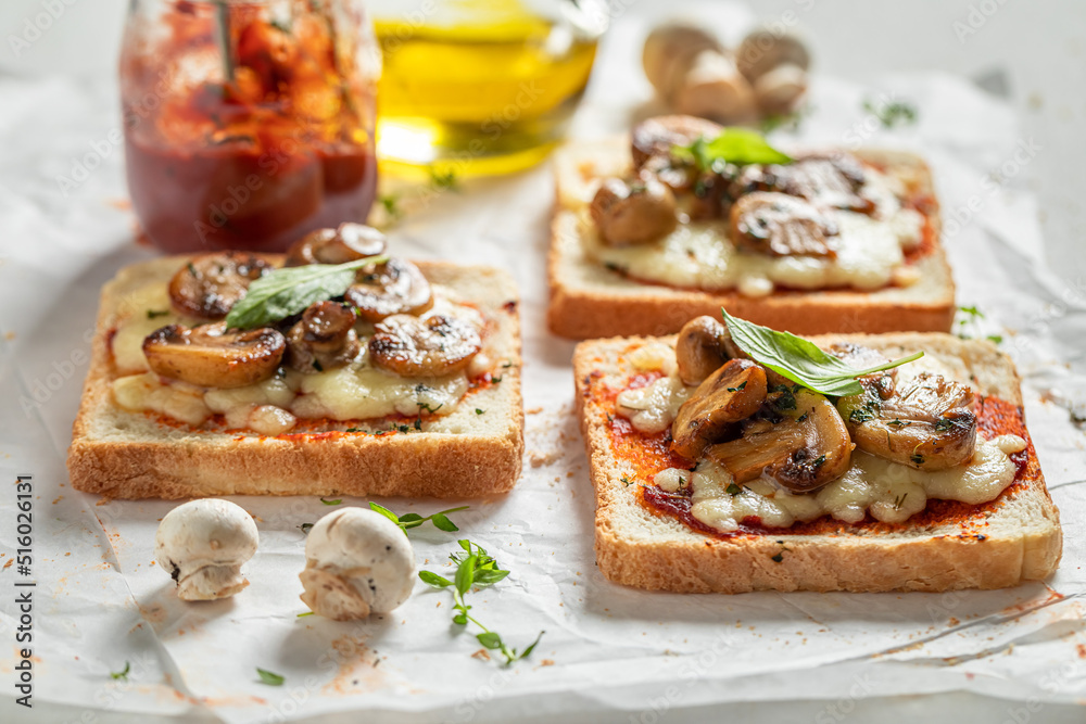 Homemade and delicious toasts made of mushrooms, pepper and cheese.