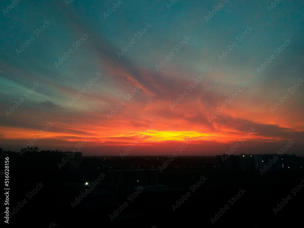 beautiful dawn in the city, colorful clouds in sky, nature photography, natural sunset scenery background 