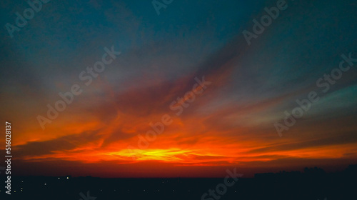 Dramatic weather conditions, beautiful dawn in the city, colorful clouds in sky, nature photography, natural scenery background 