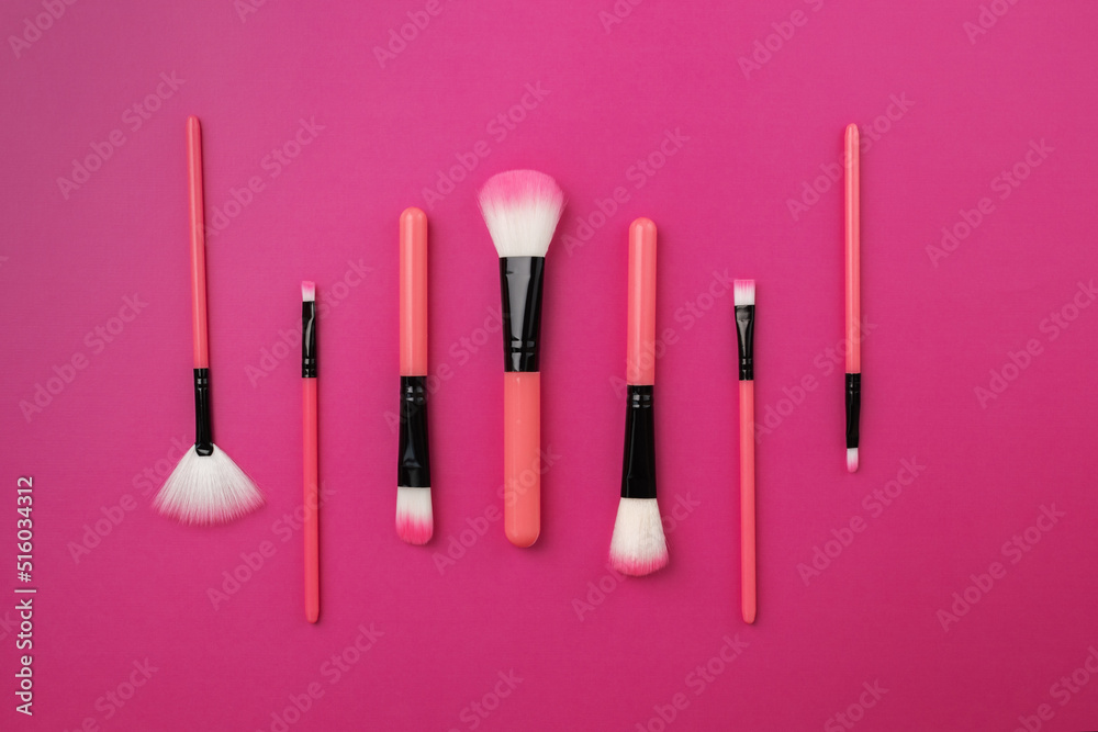 glamorous set of makeup brushes on a pink, beauty cosmetics glamorous set of makeup brushes on a pink, beauty cosmetics