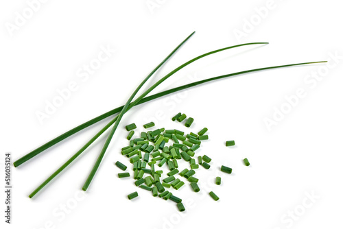 Fresh green onions or chives, close-up, isolated on white background.