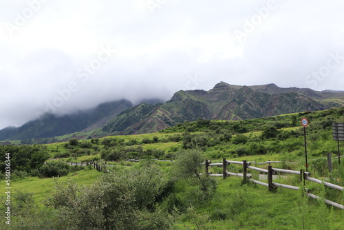 landscape with fence and clouds