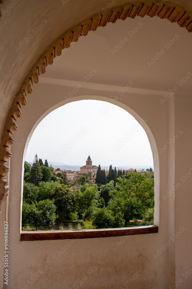 View of the Church of Santa Maria Through a window in Generalife Complex, Granada Spain
