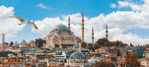 Beautiful view of gorgeous historical Suleymaniye Mosque, Rustem Pasa Mosque and buildings in a cloudy day. Istanbul most popular tourism destination of Turkey. Travel Turkey concept.
 
