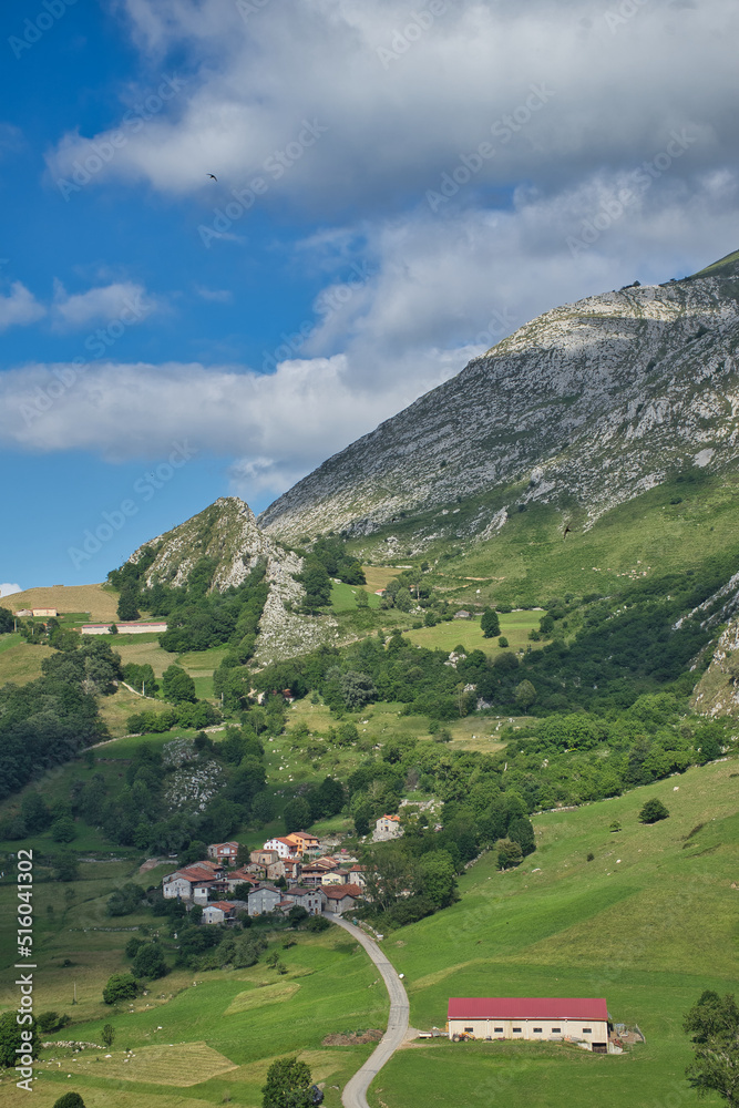Picturesque town of houses with stone facades located on the mountain top of the Picos de Europa in a rural setting.