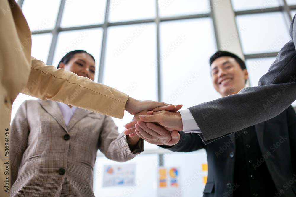 Teamwork Deal Cooperation Partnership business people giving hi-five after successful work in the office. Teamwork Deal Cooperation Partnership business people giving hi-five after successful work in the office.