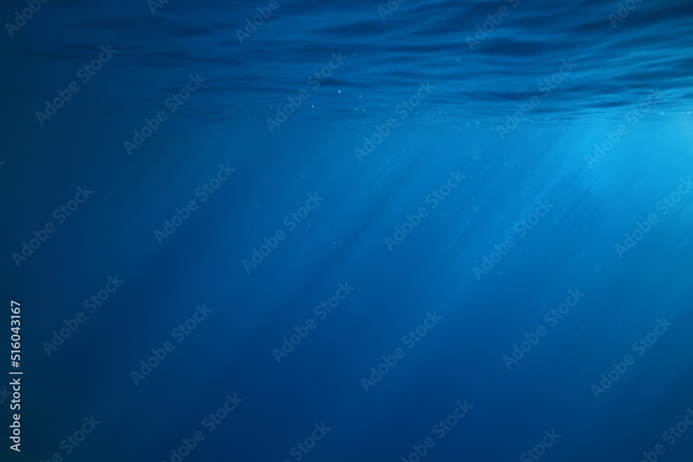 ocean underwater rays of light background, under blue water sunlight ocean underwater rays of light background, under blue water sunlight