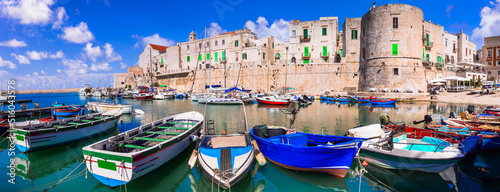 Traditional Italy. Atmosferic Puglia region with white villages and colorful fishing boats. Giovinazzo town, Bari province photo