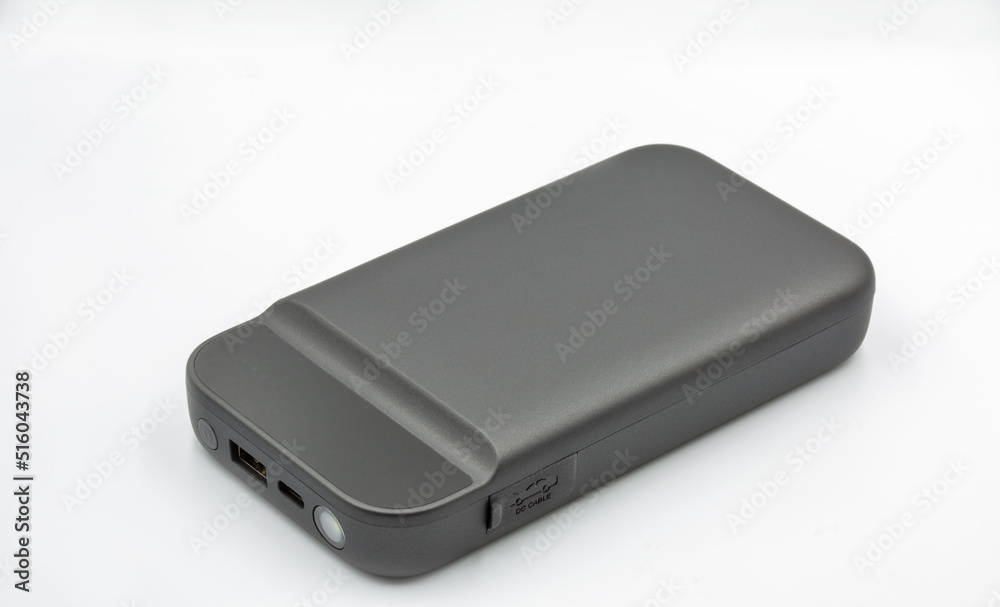 Portable car jump starter closeup on white Portable car jump starter closeup on white