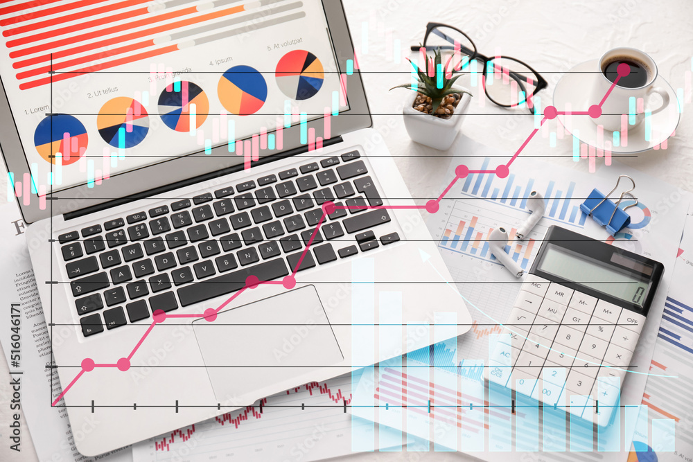 Obraz premium Double exposure of virtual screen with business diagrams, modern laptop and calculator on light background