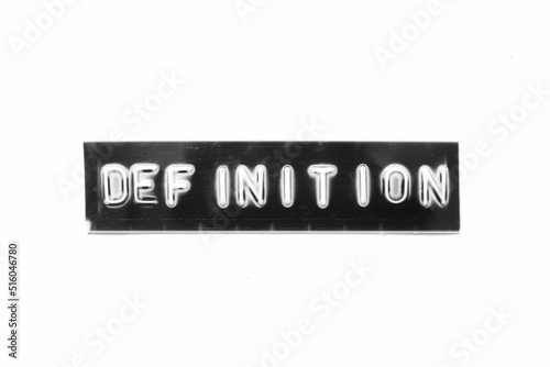 Embossed letter with word definition in black banner on white paper background