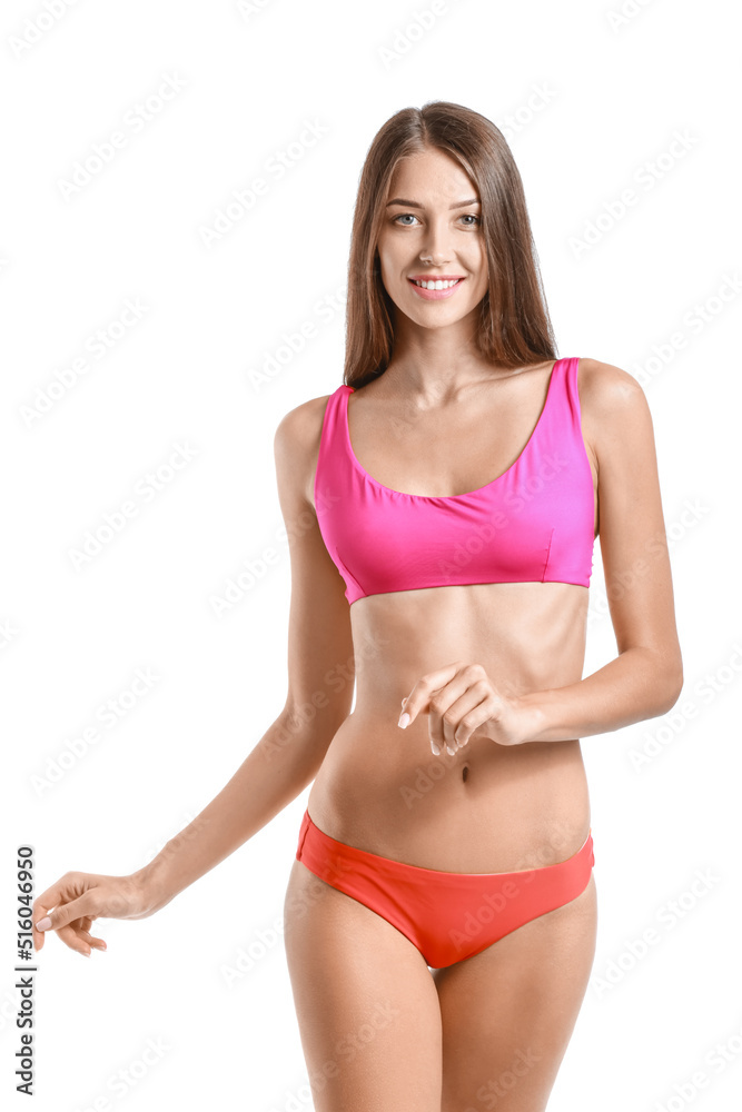 Young tanned woman in swimsuit on white background Young tanned woman in swimsuit on white background