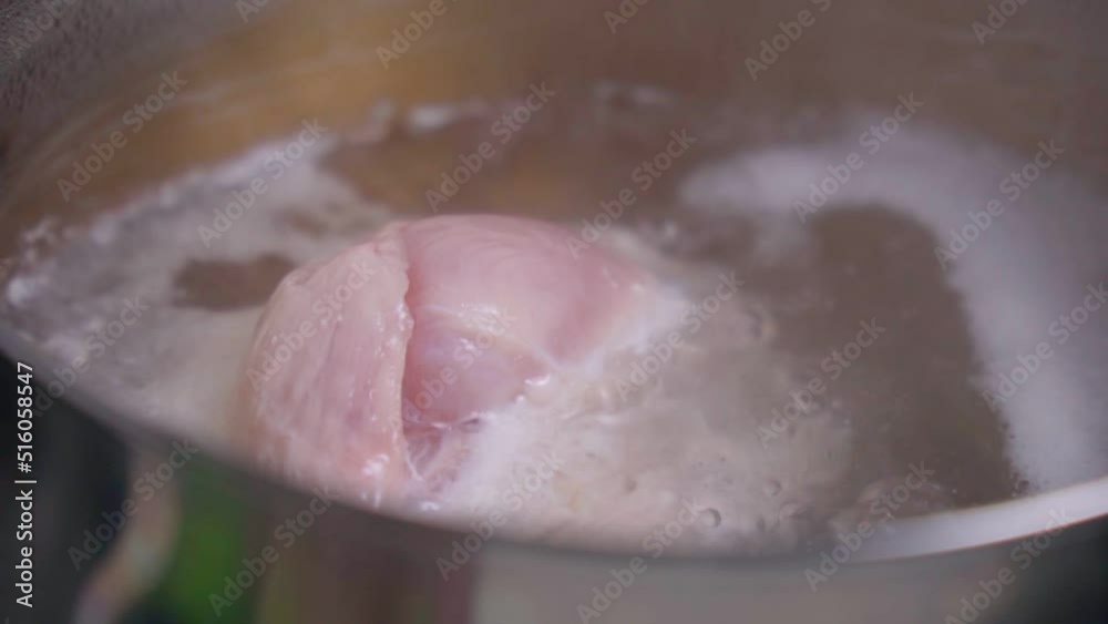 Cooking boiled turkey meat in close-up. Selective focus. Homemade food. Slow motion Cooking boiled turkey meat in close-up. Selective focus. Homemade food. Slow motion