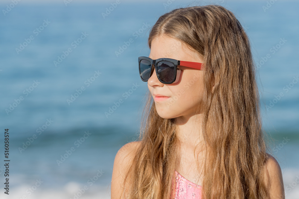 Close-up portrait of a girl in a bathing suit and glasses. Close-up portrait of a girl in a bathing suit and glasses.