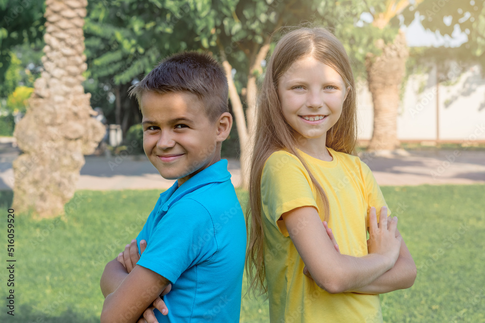 Portraits of a boy and a girl in the background of the park. Portraits of a boy and a girl in the background of the park.
