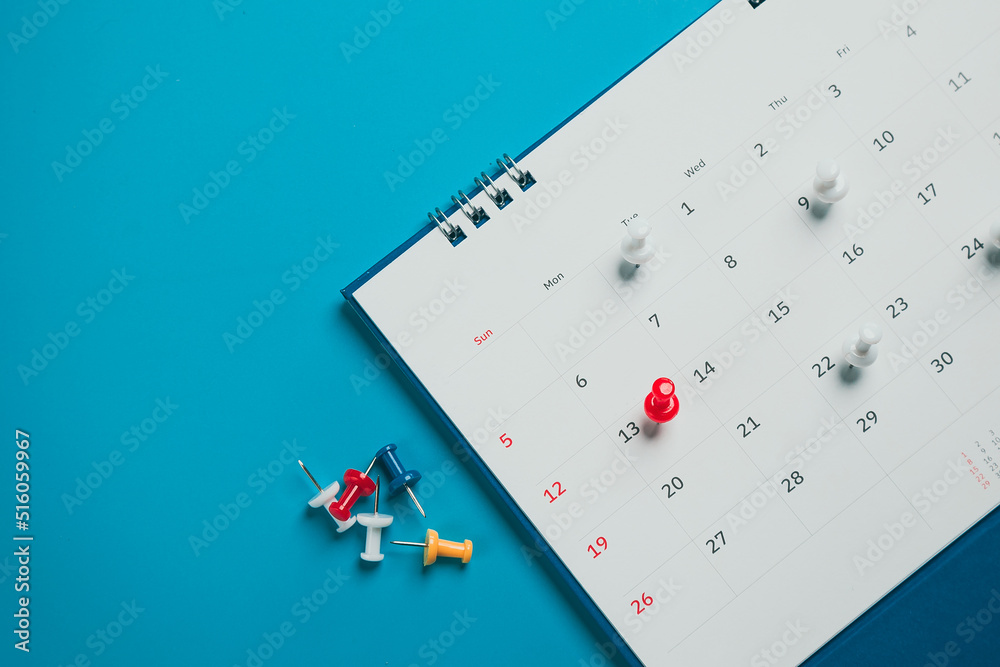 Close top view on white calendar 2022 month schedule Work planning and life concept. Close top view on white calendar 2022 month schedule Work planning and life concept.