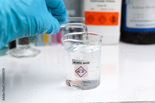 Acetic acid in glass, chemical in the laboratory photo
