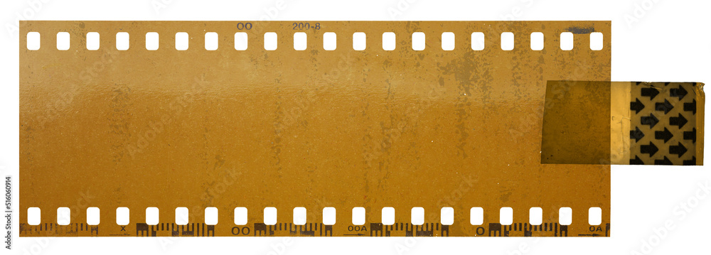 yellow looking 35mm cine film strip fixed by single plastic sticker on white background. nice retro poster element.