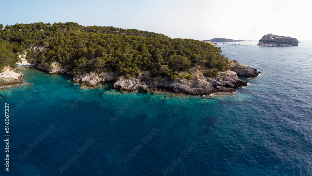 Fototapeta premium Italy, July 2022. Aerial view of the Quakes islands with their Caribbean sea