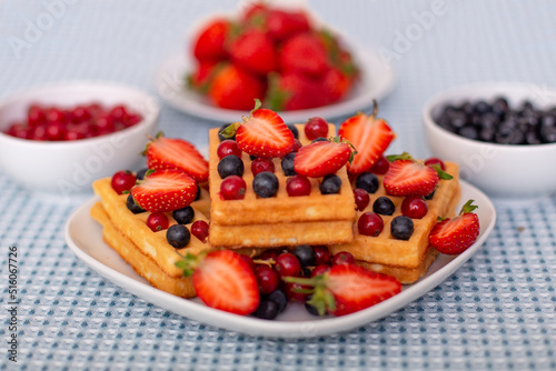  Morning breakfast with cup of tea  waffles and berries 