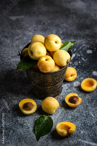 apricots in a box on dark background photo