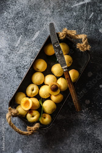 apricots in a box on dark background photo