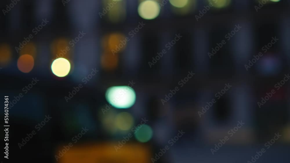 Passing by Blured Night Road with cars and carlights bokeh in a City. Driving a car at night. 4k