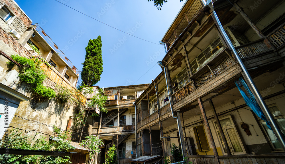 Traditional Tbilisi's inner yard with wooden carving balconies