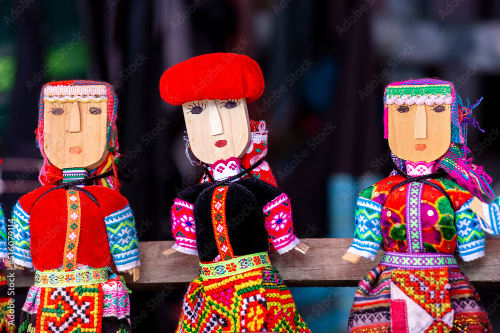 Souvenirs of Vietnam - wooden dolls dressed in national clothes.