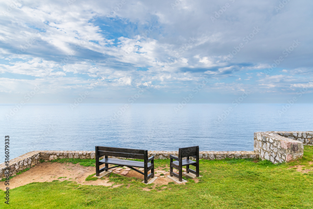 Benches on the Paseo de San Pedro, Llanes, with views of the Cantabrian Sea, Asturias.