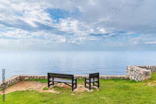Benches on the Paseo de San Pedro, Llanes, with views of the Cantabrian Sea, Asturias.