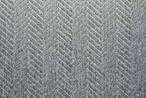 Fabric background. Sticky textured gray fabric with pattern close up. Fabric for the manufacture of fabric blinds or mat, wallpaper