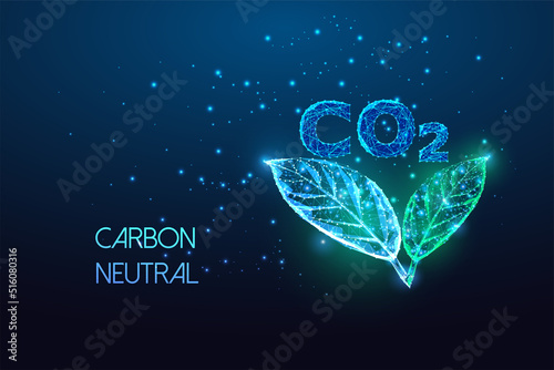 Concept of carbon neutral, net zero emission with CO2 and green leaves in futuristic glowing on blue