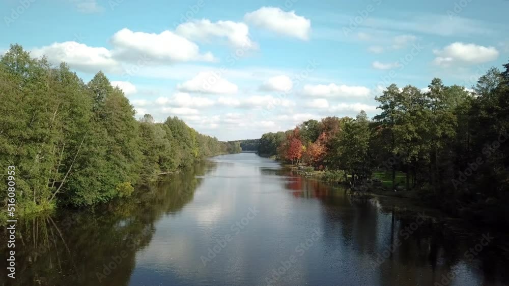 River in autumn calm flow of water River in autumn calm flow of water