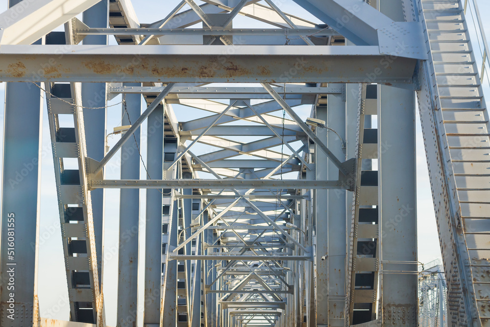 Steel supports of a road bridge across the river Steel supports of a road bridge across the river