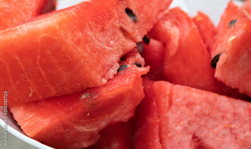 Close up of sliced watermelon without skin in a bowl Close up of sliced watermelon without skin in a bowl