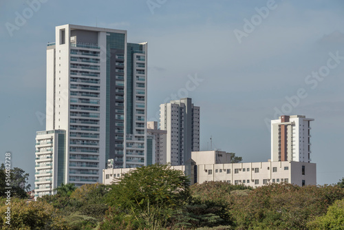 Urban scene shows larger residential and commercial building, residential building and old hotel, parts of the trees, Piracicaba SP Brazil. © Arnaldo Lameira